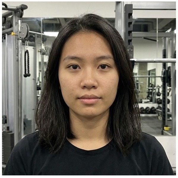Photorealistic portrait corrected from a gym background to a clean fixed 2x2 passport photo